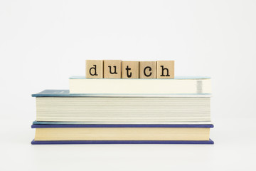 dutch language word on wood stamps and books
