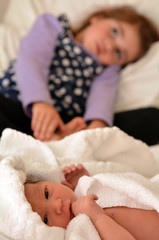 little girl and newborn sister