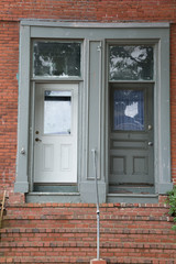 Fototapeta na wymiar Two Old Doors in Brick Building