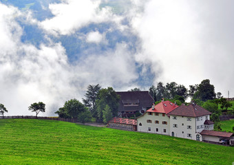 Fototapeta na wymiar Alpine house in clouds