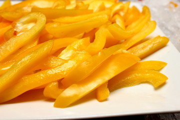 Slice of red and yellow bell pepper as salad.