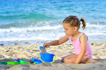 Toddler girl at beach