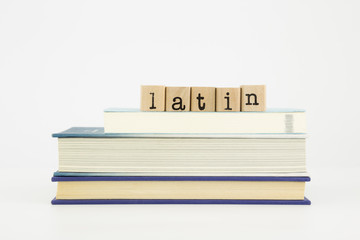 latin language word on wood stamps and books