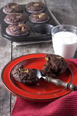 Chocolate cupcakes on a wooden table.