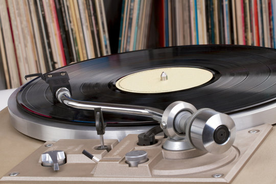 Turntable with vinyl records in the back