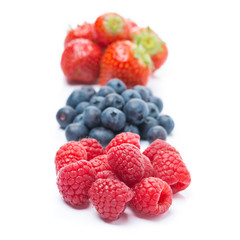 raspberries, blueberries and strawberries, close-up, isolated