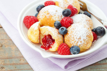 Traditional danish pancakes - ebelskivers with fresh berries