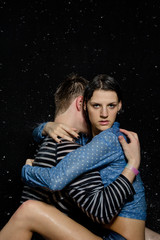 Young beautiful couple portrait in wet shirts