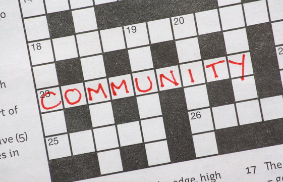 The word Community on a newspaper crossword puzzle