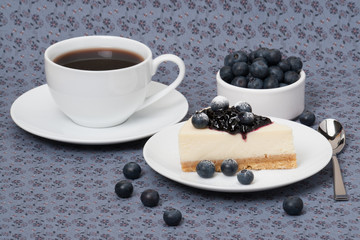 Cheese Cake With Blueberry Jam And Blueberries On White Plate