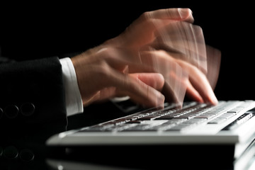 Blurred hands typing