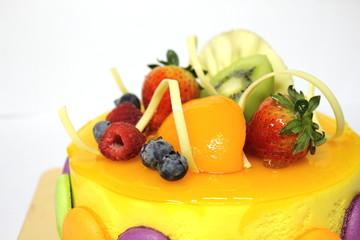 peach mousse cake and topped with fresh fruit.