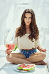 Obraz na płótnie Canvas Fashion portrait with a beautiful girl with watermelon