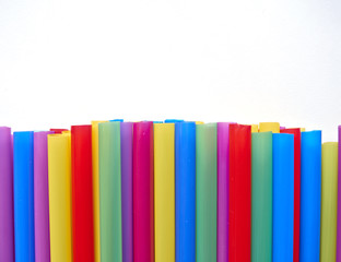 variety of drinking straws on white paper, space for typing