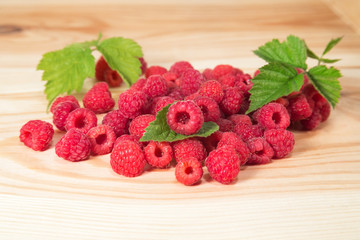 Raspberry berries on wooden background
