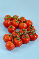 Cherry tomatoes on blue background