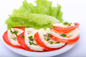 Tomato with mozzarella and salad