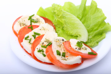 Tomato with mozzarella and salad