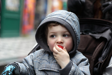 Child eating strawberries