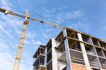 Concrete building and crane