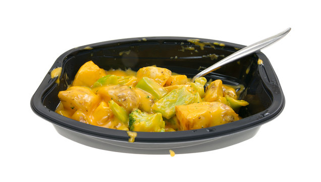 TV dinner of broccoli and potatoes in cheese sauce