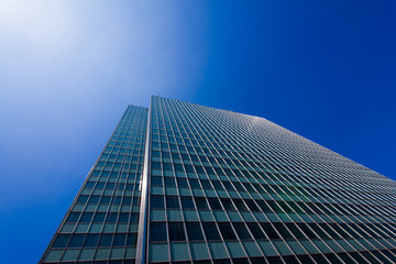 Fototapeta na wymiar Modern glass silhouettes on modern building.