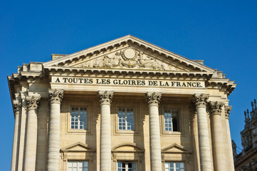 Versailles building that says "To All the Glories of France."