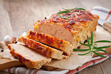 Homemade ground meatloaf with ketchup and rosemary © timolina