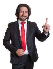 Pointing turkish businessman with suit