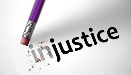Eraser changing the word Injustice for Justice