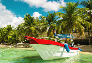Amazing boat on sandy Tropical Caribbean beach