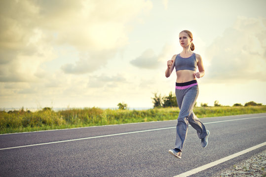woman jogs runs on nature