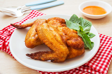 Roasted chicken wings on plate