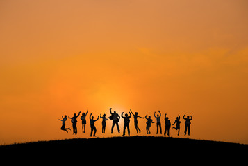 Silhouettes of Business People with Arms Raised