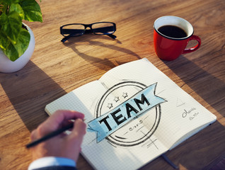 Man with a Notebook with Team Concept