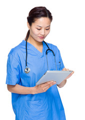 Female doctor use tablet