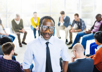 African Descent Man and Praying Group of People