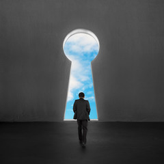 Fototapeta premium Walking toward key shape door