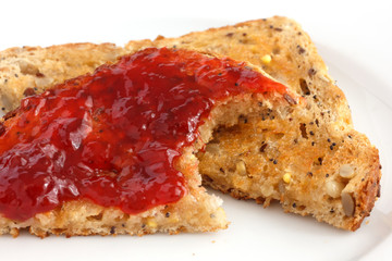 Multi-seed wholegrain bread toasted and buttered with jam