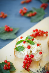 sandwich with cheese and red currants