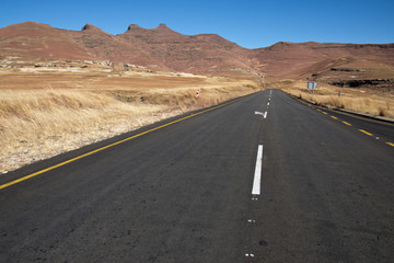 Fototapeta na wymiar Straight Road Heading Towards Mountains in Orange Free State