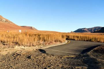 Desolate Rural Road Showing where Asphalt Ends and Dirt Begins