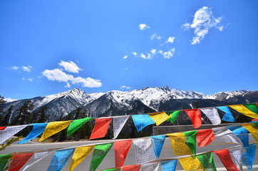 Tibetan Prayer Flags on Snow Mountains