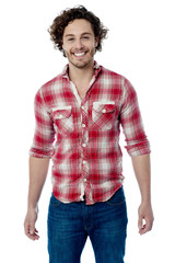 Smiling young casual man posing