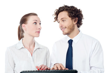 Young secretaries typing in keyboard