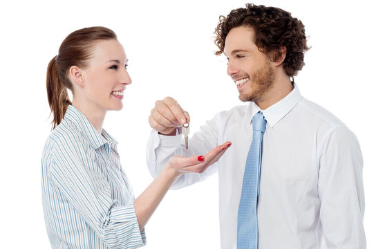 Businessman Handing Over The Key