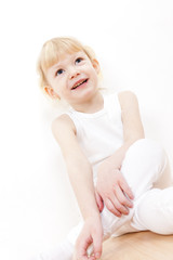 portrait of little girl wearing white clothes