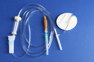 Disposable infusion set on blue background
