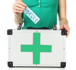 Woman holding first aid kit, isolated on white