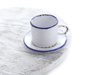 Small white cup isolated on white